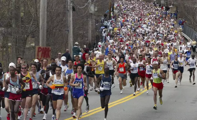 FILE - The 110th Boston Marathon elite runners lead the race, Monday, April 17, 2006, after crossing the start line in Hopkinton, Mass. Once a year for the last 100 years, Hopkinton becomes the center of the running world, thanks to a quirk of geography and history that made it the starting line for the world's oldest and most prestigious annual marathon. (AP Photo/Bizuayehu Tesfaye, File)