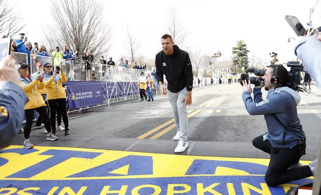 Grand Marshal and former New England Patriots NFL football player Rob Gronkowski poses at the start of the Boston Marathon, Monday, April 15, 2024, in Hopkinton, Mass. (AP Photo/Mary Schwalm)