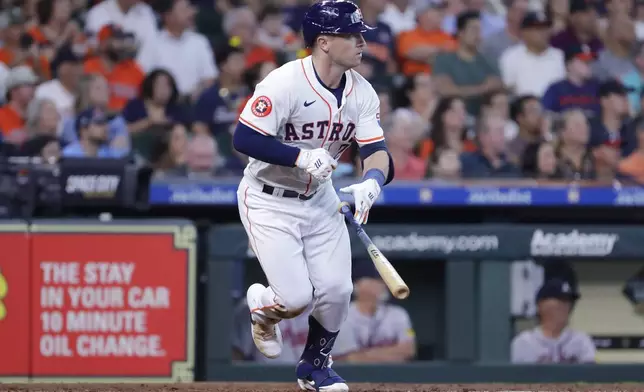 Houston Astros' Alex Bregman flips his bat as he heads to first base for an RBI single against the Atlanta Braves during the fifth inning of a baseball game Wednesday, April 17, 2024, in Houston. (AP Photo/Michael Wyke)