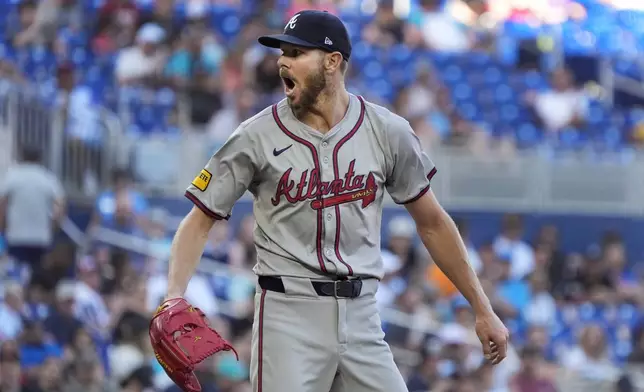 Atlanta Braves starting pitcher Chris Sale reacts after walking Miami Marlins' Jake Burger during the fifth inning of a baseball game, Saturday, April 13, 2024, in Miami. (AP Photo/Wilfredo Lee)