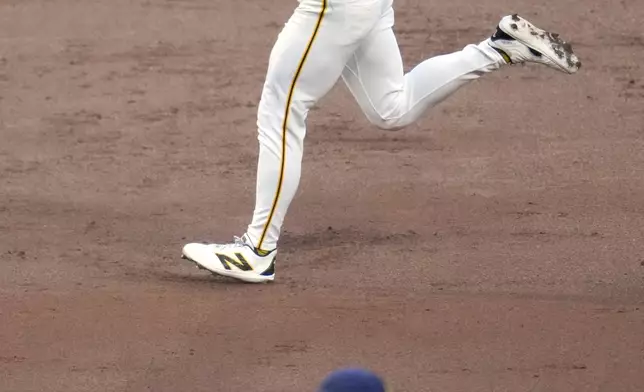 Pittsburgh Pirates' Bryan Reynolds (10) rounds the bases after hitting a two-run home run off starting pitcher Bryse Wilson (46) during the third inning of a baseball game in Pittsburgh, Wednesday, April 24, 2024. (AP Photo/Gene J. Puskar)