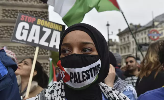 Pro-Palestinian protesters take part in a demonstration in London, Saturday, April 27, 2024. (AP Photo/Thomas Krych)