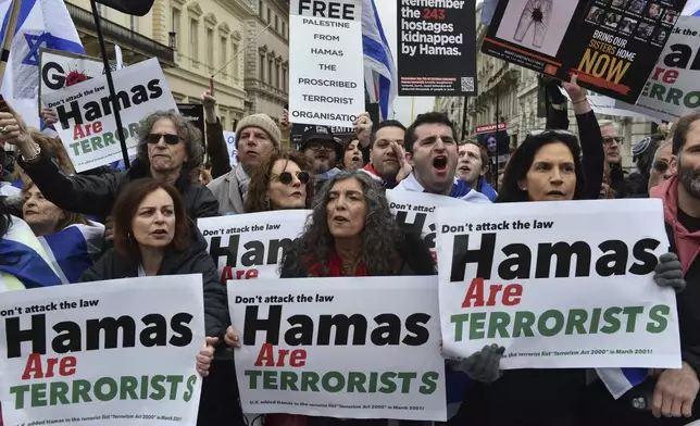 Pro-Israeli protesters take part in a demonstration along the route of the Pro-Palestinian march in London, Saturday, April 27, 2024. (AP Photo/Thomas Krych)