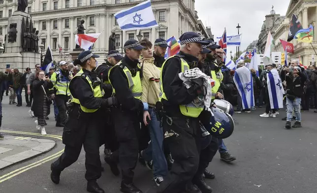Police arrest a Pro-Palestinian protester during a demonstration in London, Saturday, April 27, 2024.