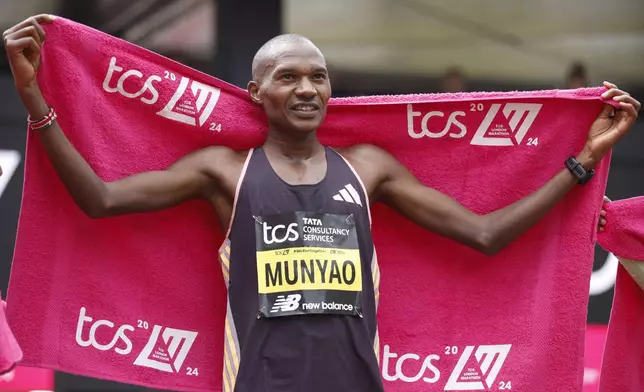 Alexander Mutiso Munyao of Kenya reacts after winning the men's race at the London Marathon in London, Sunday, April 21, 2024.(AP Photo/David Cliff)