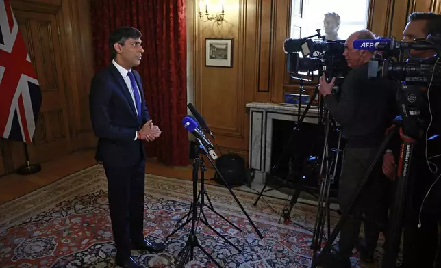Britain's Prime Minister Rishi Sunak records a statement on the Iranian attacks on Israel overnight, inside 10 Downing Street, London, Sunday, April 14, 2024. Israel praised the success of its defenses in the face of an unprecedented attack by Iran involving hundreds of drones, ballistic missiles and cruise missiles. (Benjamin Cremel/Pool via AP)