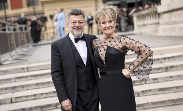 Andy Serkis, left, and Lorraine Ashbourne pose for photographers upon arrival at the Olivier Awards on Sunday, April 14, 2024, in London. (Photo by Vianney Le Caer/Invision/AP)