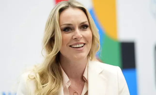 Lindsey Vonn, Olympic Skiing Champion, smiles as she is interviewed at the International Olympic Committee launch of the Olympic AI Agenda at Lee Valley VeloPark, in London, Friday, April 19, 2024. They will be presenting the envisioned impact that artificial intelligence can deliver for sport, and how the IOC intends to lead on the global implementation of AI within sport. (AP Photo/Kirsty Wigglesworth)