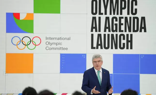 Thomas Bach, IOC President speaks at the International Olympic Committee launch of the Olympic AI Agenda at Lee Valley VeloPark, in London, Friday, April 19, 2024. The IOC will be presenting the envisioned impact that artificial intelligence can deliver for sport, and how the IOC intends to lead on the global implementation of AI within sport. (AP Photo/Kirsty Wigglesworth)