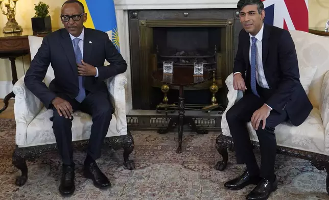 Britain's Prime Minister Rishi Sunak, right, and the President of Rwanda Paul Kagame pose for the media, ahead of their meeting inside 10 Downing Street in London, Tuesday, April 9, 2024. (AP Photo/Alberto Pezzali, Pool)