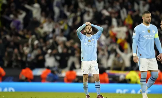 Manchester City's Bernardo Silva reacts after losing the Champions League quarterfinal second leg soccer match against Real Madrid at the Etihad Stadium in Manchester, England, Wednesday, April 17, 2024. (AP Photo/Dave Thompson)