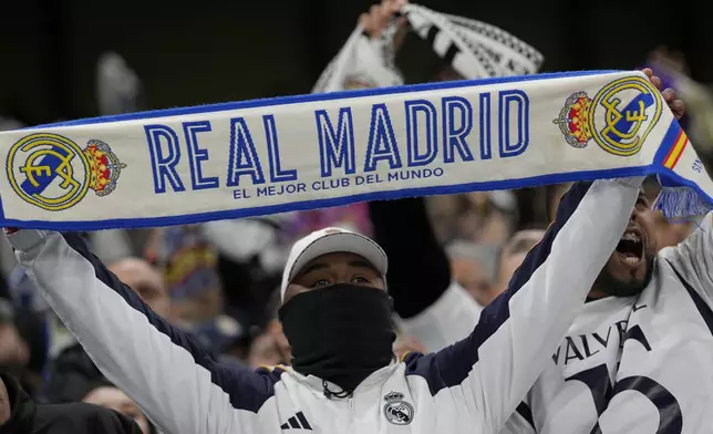 Real Madrid fans cheer during the Champions League quarterfinal second leg soccer match between Manchester City and Real Madrid at the Etihad Stadium in Manchester, England, Wednesday, April 17, 2024. (AP Photo/Dave Shopland)