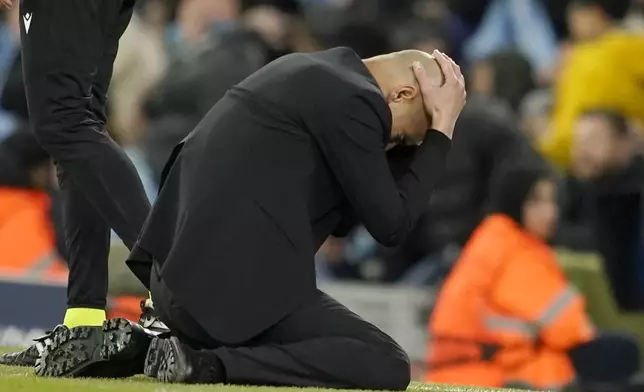 Manchester City's head coach Pep Guardiola reacts during the Champions League quarterfinal second leg soccer match between Manchester City and Real Madrid at the Etihad Stadium in Manchester, England, Wednesday, April 17, 2024. (AP Photo/Dave Thompson)