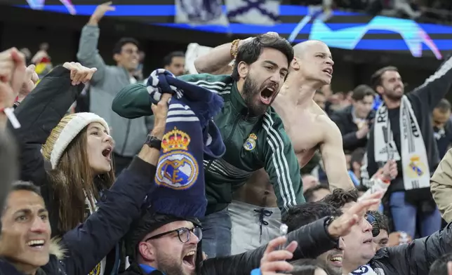 Real Madrid Fans celebrate victory during the Champions League quarterfinal second leg soccer match between Manchester City and Real Madrid at the Etihad Stadium in Manchester, England, Wednesday, April 17, 2024. (AP Photo/Dave Shopland)