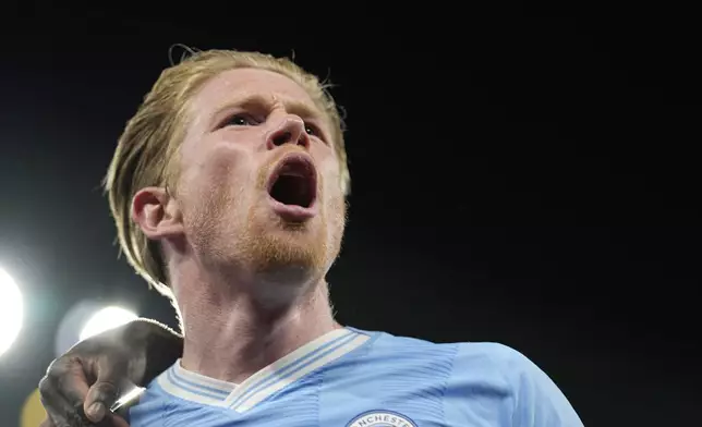 Manchester City's Kevin De Bruyne celebrates after scoring his side's opening goal during the Champions League quarterfinal second leg soccer match between Manchester City and Real Madrid at the Etihad Stadium in Manchester, England, Wednesday, April 17, 2024. (AP Photo/Dave Shopland)