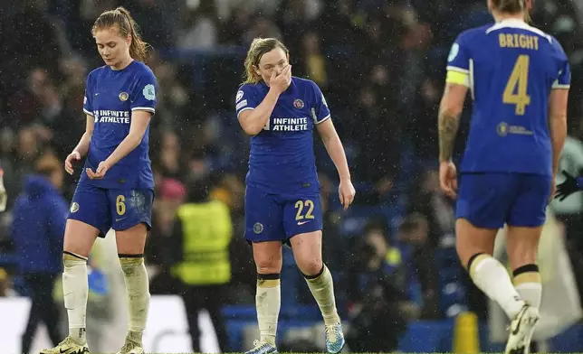 Chelsea's Erin Cuthbert, center, reacts after the Women's Champions League, semi final second leg, soccer match between FC Chelsea and FC Barcelona in London, England, Saturday, April 27, 2024. (Zac Goodwin/PA via AP)
