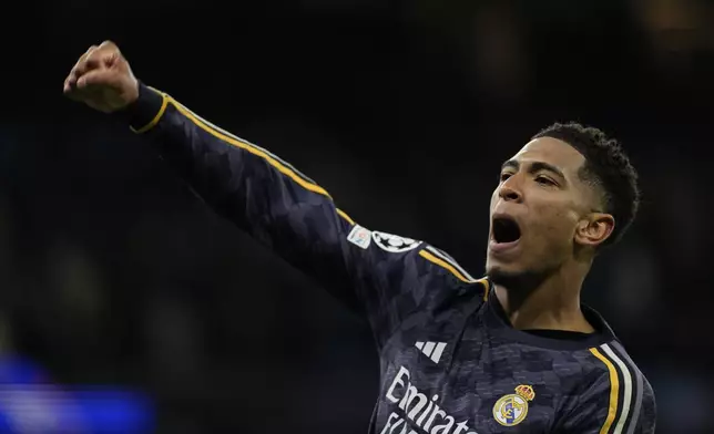 Real Madrid's Jude Bellingham celebrates at the end of the Champions League quarterfinal second leg soccer match between Manchester City and Real Madrid at the Etihad Stadium in Manchester, England, Wednesday, April 17, 2024. (AP Photo/Dave Shopland)