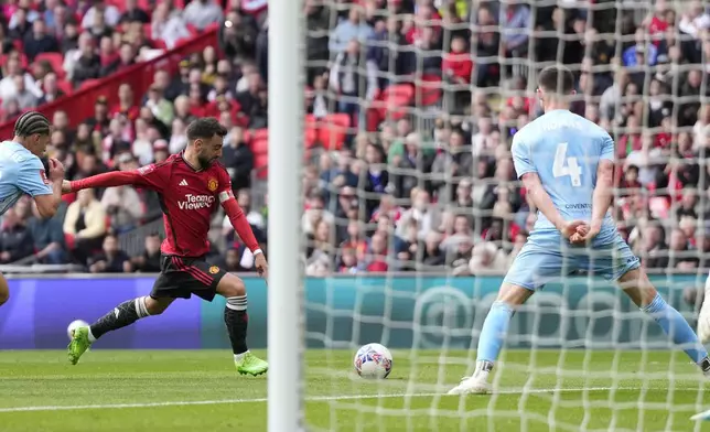 Manchester United's Bruno Fernandes scores his side's third goal during the English FA Cup semifinal soccer match between Coventry City and Manchester United at Wembley stadium in London, Sunday, April 21, 2024. (AP Photo/Alastair Grant)