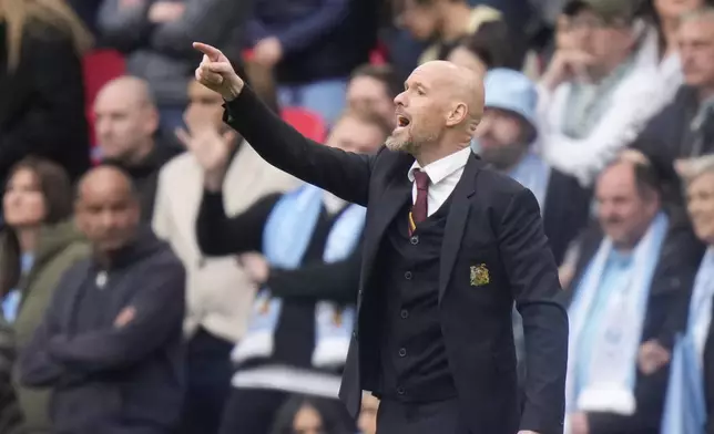 Manchester United's head coach Erik ten Hag shouts to his players from the sideline during the English FA Cup semifinal soccer match between Coventry City and Manchester United at Wembley stadium in London, Sunday, April 21, 2024. (AP Photo/Alastair Grant)