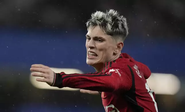 Manchester United's Alejandro Garnacho gestures during the English Premier League soccer match between Chelsea and Manchester United at Stamford Bridge in London, Thursday, April 4, 2024. (AP Photo/Kin Cheung)