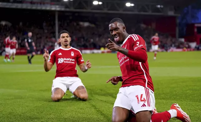 Nottingham Forest's Callum Hudson-Odoi, right, celebrates scoring the opening goal during the English Premier League soccer match between Nottingham Forest and Fulham at the City Ground, in Nottingham, England, Tuesday, April 2, 2024. (Bradley Collyer/PA via AP)