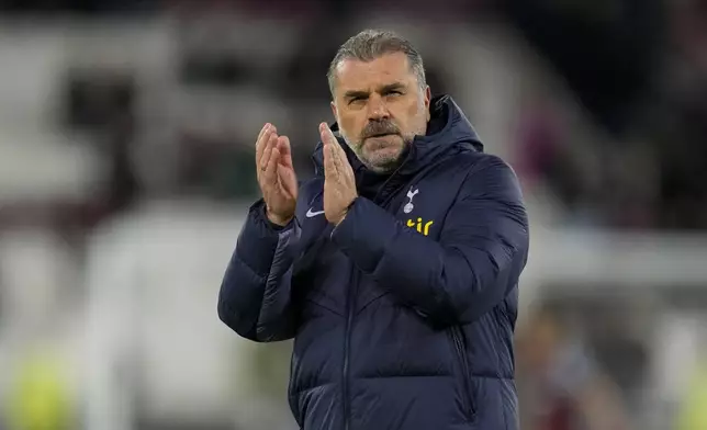 Tottenham's head coach Ange Postecoglou applauds at the end of the English Premier League soccer match between West Ham and Tottenham, at the London stadium in London, Tuesday, April 2, 2024. (AP Photo/Kirsty Wigglesworth)