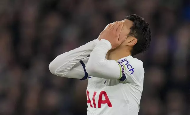 Tottenham's Son Heung-min reacts after missing a chance to score during the English Premier League soccer match between West Ham and Tottenham, at the London stadium in London, Tuesday, April 2, 2024. (AP Photo/Kirsty Wigglesworth)