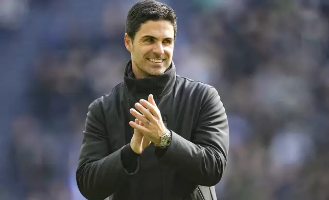 Arsenal's manager Mikel Arteta celebrates at the end of the English Premier League soccer match between Tottenham Hotspur and Arsenal at the Tottenham Hotspur Stadium in London, England, Sunday, April 28, 2024. (AP Photo/Kin Cheung)