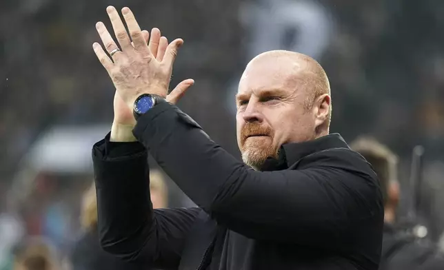Everton's head coach Sean Dyche applauds the fans ahead of the English Premier League soccer match between Newcastle United and Everton at St. James' Park, in Newcastle, England, Tuesday, April 2, 2024. (Owen Humphreys/PA via AP)