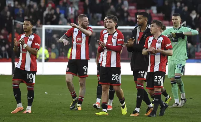 Sheffield United players greet fans after the English Premier League soccer match between Sheffield United and Chelsea at Bramall Lane stadium in Sheffield, England, Sunday, April 7, 2024. (AP Photo/Rui Vieira)
