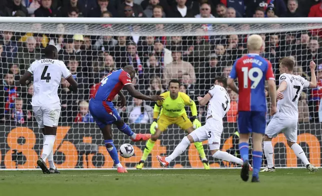Crystal Palace's Jean-Philippe Mateta, scores their fifth goal of the game during the English Premier League soccer match between West Ham United and Crystal Palace at Selhurst Park in London, Sunday April 21, 2024. (Steven Paston/PA via AP)