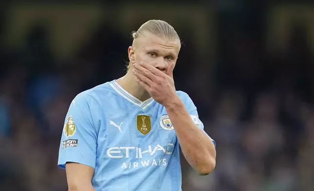 Manchester City's Erling Haaland reacts during the English Premier League soccer match between Manchester City and Arsenal at the Etihad stadium in Manchester, England, Sunday, March 31, 2024. (AP Photo/Dave Thompson)