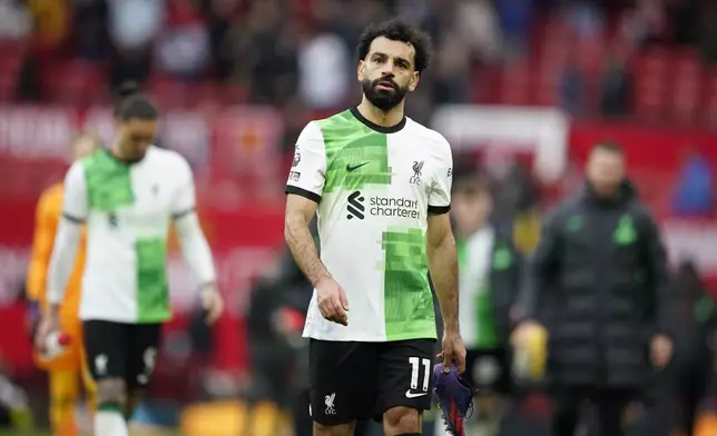 Liverpool's Mohamed Salah reacts after the English Premier League soccer match between Manchester United and Liverpool at the Old Trafford stadium in Manchester, England, Sunday, April 7, 2024. (AP Photo/Dave Thompson)