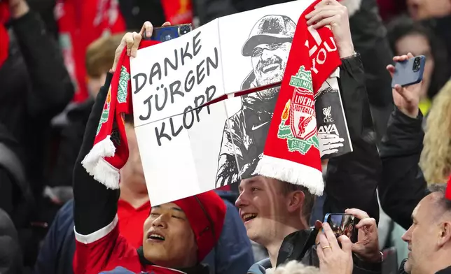 Supporters of Liverpool team hold a banner "Thank you Jurgen Klopp" ahead the English Premier League soccer match between Liverpool and Sheffield United at the Anfield stadium in Liverpool, England, Thursday, Apr. 4, 2024. (AP Photo/Jon Super)