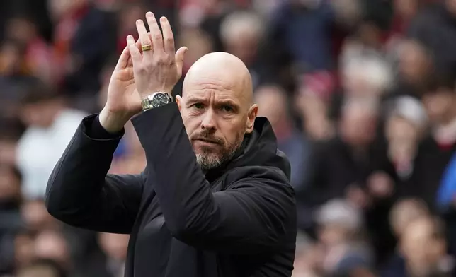 Manchester United's head coach Erik ten Hag applauds during the English Premier League soccer match between Manchester United and Liverpool at the Old Trafford stadium in Manchester, England, Sunday, April 7, 2024. (AP Photo/Dave Thompson)