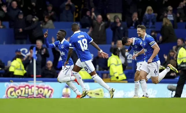 Everton's Idrissa Gueye, left, celebrates after scoring the opening goal during the English Premier League soccer match between FC Everton and FC Brentford in Liverpool, England, Saturday, April 27, 2024. (Peter Byrne/PA via AP)