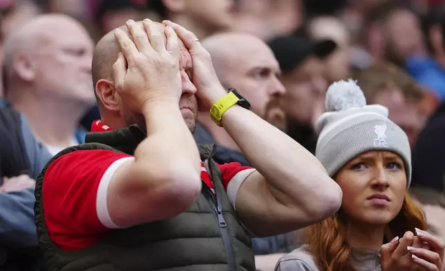 Disappointed Liverpool fans during the English Premier League soccer match between Liverpool and Crystal Palace at Anfield Stadium in Liverpool, England, Sunday, April 14, 2024. (AP Photo/Jon Super)