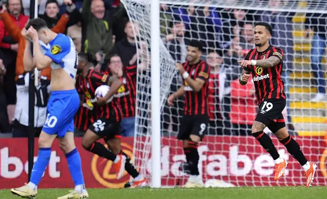 Bournemouth's Justin Kluivert, right, celebrates after scoring his side's third goal during the English Premier League soccer match between AFC Bournemouth and Brighton &amp; Hove Albion in Bournemouth, England, Sunday, April 28, 2024. (Adam Davy/PA via AP)