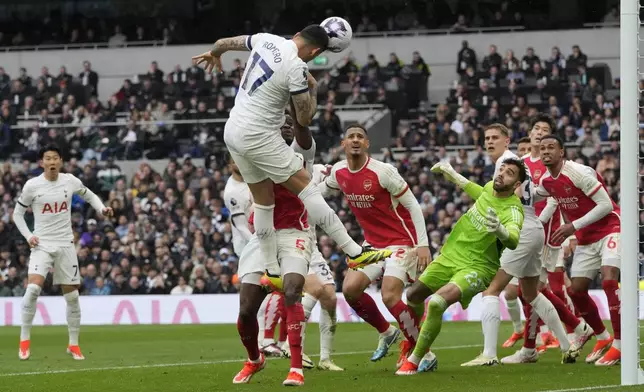 Tottenham's Cristian Romero attempts to score during the English Premier League soccer match between Tottenham Hotspur and Arsenal at the Tottenham Hotspur Stadium in London, England, Sunday, April 28, 2024. (AP Photo/Kin Cheung)
