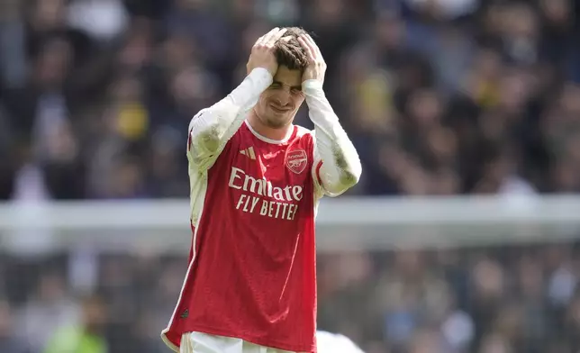 Arsenal's Kai Havertz reacts after missing an opportunity during the English Premier League soccer match between Tottenham Hotspur and Arsenal at the Tottenham Hotspur Stadium in London, England, Sunday, April 28, 2024. (AP Photo/Kin Cheung)