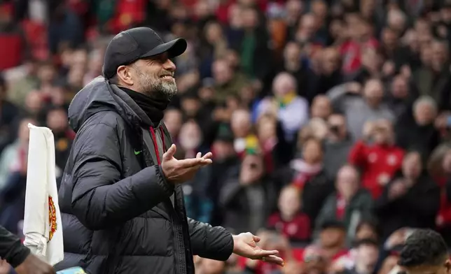 Liverpool's manager Jurgen Klopp reacts after the English Premier League soccer match between Manchester United and Liverpool at the Old Trafford stadium in Manchester, England, Sunday, April 7, 2024. (AP Photo/Dave Thompson)
