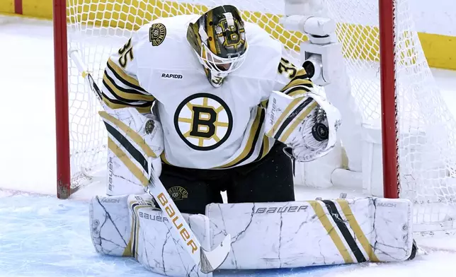 Boston Bruins' goaltender Linus Ullmark makes a glove save against the Pittsburgh Penguins during the first period of an NHL hockey game Saturday, April 13, 2024, in Pittsburgh. (AP Photo/Matt Freed)
