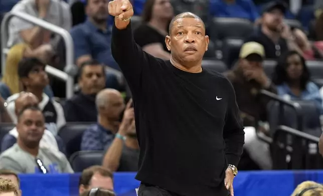 Milwaukee Bucks head coach Doc Rivers directs his players against the Orlando Magic during the first half of an NBA basketball game, Sunday, April 14, 2024, in Orlando, Fla. (AP Photo/John Raoux)