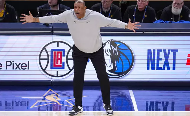 Milwaukee Bucks head coach Doc Rivers questions a call during the first half against the Indiana Pacers in Game 2 in an NBA basketball first-round playoff series, Friday, April 26, 2024, in Indianapolis. (AP Photo/Michael Conroy)
