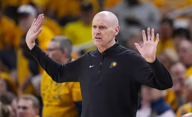 Indiana Pacers head coach Rick Carlisle signals to his team during the second half against the Milwaukee Bucks in Game 2 in an NBA basketball first-round playoff series, Friday, April 26, 2024, in Indianapolis. (AP Photo/Michael Conroy)