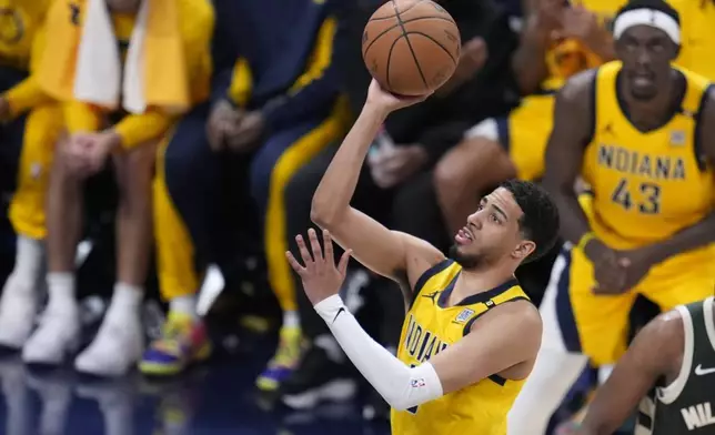 Indiana Pacers' Tyrese Haliburton puts up a shot during the first half of Game 4 of the first round NBA playoff basketball series against the Milwaukee Bucks, Sunday, April 28, 2024, in Indianapolis. (AP Photo/Michael Conroy)