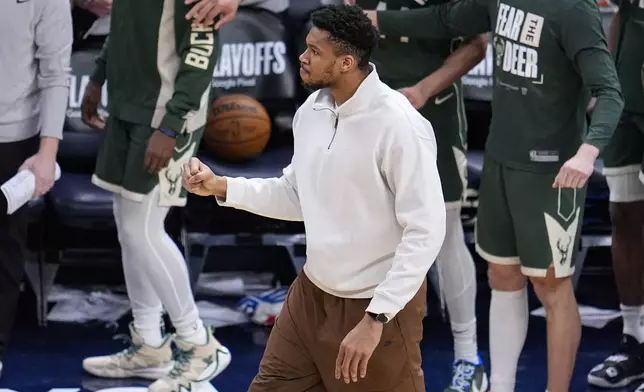 Milwaukee Bucks forward Giannis Antetokounmpo celebrates as the Bucks tied the game at the end of the second half in Game 2 against the Indiana Pacers in an NBA basketball first-round playoff series, Friday, April 26, 2024, in Indianapolis. (AP Photo/Michael Conroy)