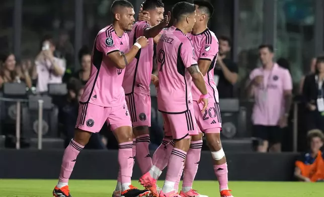 Inter Miami midfielder Tomás Aviles, second from left, is congratulated after scoring a goal against Monterrey during the first half of a CONCACAF Champions Cup quarterfinal soccer match Wednesday, April 3, 2024, in Fort Lauderdale, Fla. (AP Photo/Lynne Sladky)