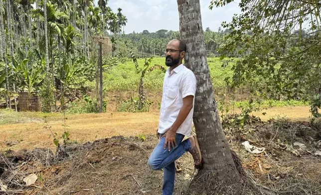 CORRECTS JOURNALIST'S FIRST NAME - Indian journalist Sidhique Kappan poses for a photograph near his home in Kerala, India, April 1, 2024. He was charged in 2020 on allegations of inciting violence while trying to report on a government clampdown in the northern Uttar Pradesh state ruled by the party of Prime Minister Narendra Modi. The time it takes to defend himself has made it difficult to work to support his family. (AP Photo/R S Iyer)