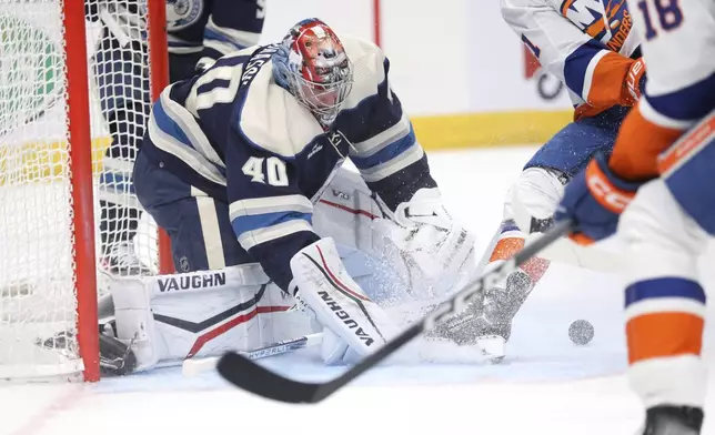 CORRECTS TO APTIL NOT MARCH - Columbus Blue Jackets goaltender Daniil Tarasov (40) saves the puck during the first period of an NHL hockey game against the New York Islanders, Thursday, April 4, 2024, in Columbus, Ohio. (AP Photo/Joe Maiorana)